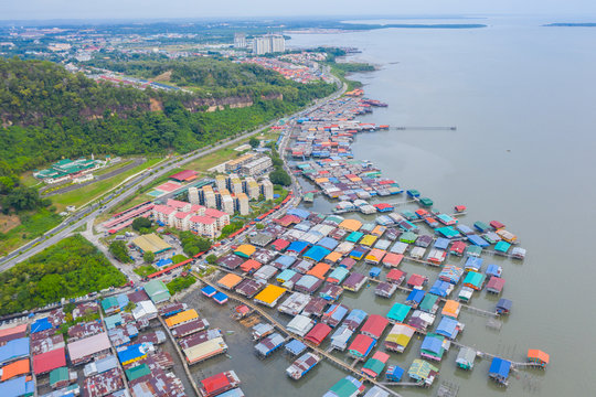 An aerial image of local water village houses at Kg. Sim Sim water village Sandakan City, Sabah, Malaysia. Sandakan once known as Little Hong Kong of Borneo.