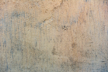 Texture of a concrete wall with cracks and scratches which can be used as a background