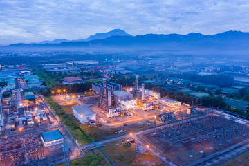 Aerial image of Electricity transmission sub-station and power plant during sunrise at Sabah, Borneo