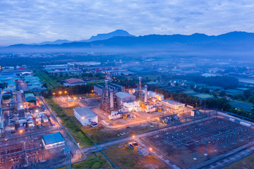 Obraz premium Aerial image of Electricity transmission sub-station and power plant during sunrise at Sabah, Borneo