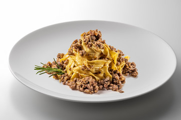 Elegant White round bowl with tagliatelle Bolognese