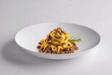 Elegant White round bowl with tagliatelle Bolognese