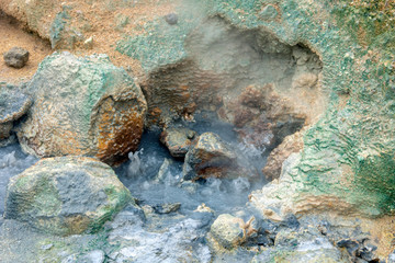 Bubbling hot water from the ground in geothermal area in Iceland. Power, hot, powerful, sulfur, texture concept.
