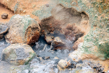Bubbling hot water from the ground in geothermal area in Iceland. Power, hot, powerful, sulfur, texture concept.