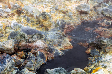 Bubbling hot water from the ground in geothermal area in Iceland. Power, hot, powerful, sulfur, texture concept.