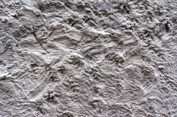 Obraz premium Rough dark gray relief plastered wall. Blank texture, background, blank for designers