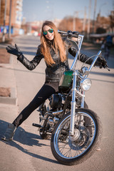 Fototapeta na wymiar Tanya. motorcycle, black jacket, half height!