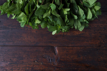 Fresh mint on rustic wooden background