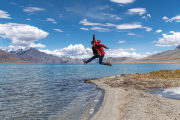 Traveler man enjoy Pangong Lake (Pangong Tso) Merak, Leh, Jammu and Kashmir ,India.