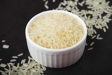 A glass bowl with white long-grain rice