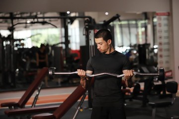 Fototapeta premium Asian man exercising in the gym. fitness health body good.