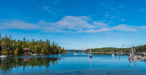 Fototapeta premium Sunny Morning on Mystery Bay-Marrowstone Island with Sailboats, Fishing Boats & Vacation Home in October
