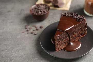 Delicious fresh chocolate cake served on grey table