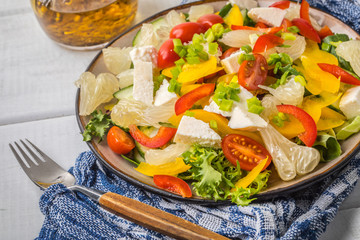 Salad with cheese and fresh vegetables.