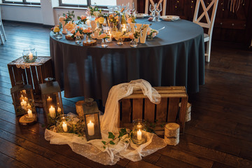on festive table in wedding banquet. the table is decorated with compositions of greenery