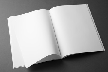 Blank book on dark grey background. Mock up for design