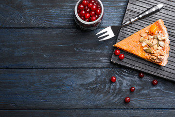 Flat lay composition with delicious fresh homemade pumpkin pie on dark wooden table. Space for text
