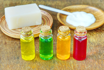 Closeup four organic oil in the bottles on the table for produce apothecary cosmetic product.