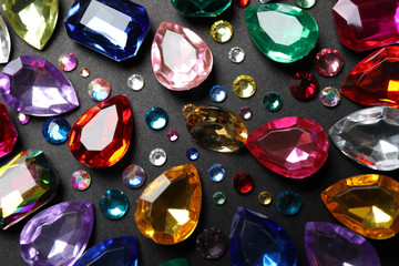 Flat lay composition with beautiful gemstones on dark background