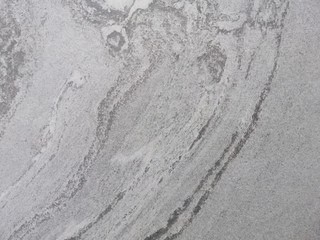 dark grey marble abstract pattern on tile floor with smooth surface for texture. Free style and natural of stone pattern.