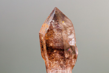 macro mineral stone smoky quartz on a black background
