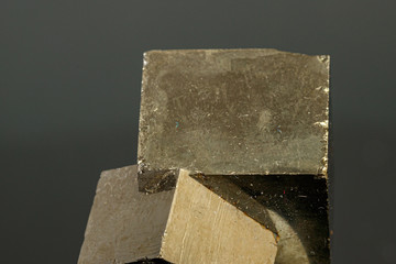 macro mineral pyrite stone on a black background
