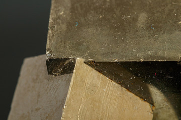 macro mineral pyrite stone on a black background