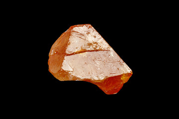 macro mineral stone Scheelite on a black background