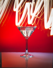 Welcome drink in a night club cocktails on illuminated bar counter