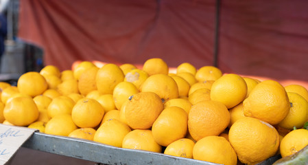 Tangerines on counter for sale.