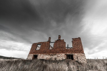 Dark Clouds Over Ruin Of A House