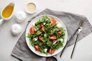 fresh salad caprese on white background. Top view