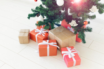 Christmas gift boxes and fir tree, top view