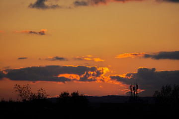 Fantastic Dramatic bright Sunny sunset over the industrial city. Silhouette of City. Selective Focus. Beautiful Natural Bright Colors.Red, pink and blue bright sunset over the city.