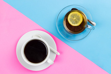 cup of tea with lemon and a cup of coffee on a wooden surface, the choice between coffee and tea	
