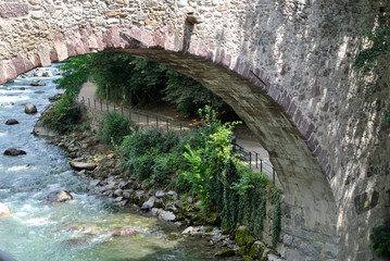 part of the roman bridge over Passirio river in Italy