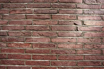 Close up view of red / brown brick wall.