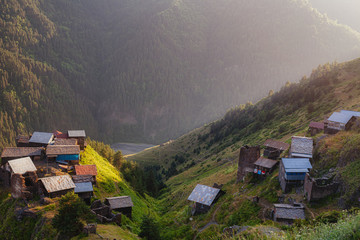 A small traditional Georgian village high in the Caucasus mountains. Stone houses, ruins. - 300729071