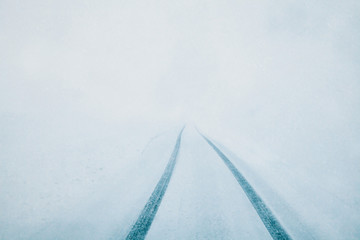 Heavy snowfall. Snowy highway, poor visibility. - 300729240