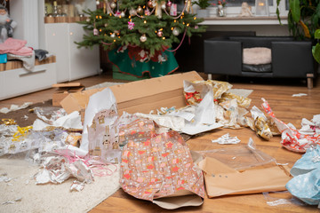 It is holy night. The gifts are unpacked. There is a mess of wrapping paper and boxes throughout...