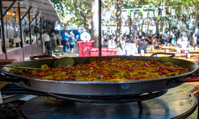 Street food in Fiesta de San Mateo - Rioja Wine Harvest Festival, Logroño, La Rioja, Spain. Paella, Spanish traditional cuisine.
