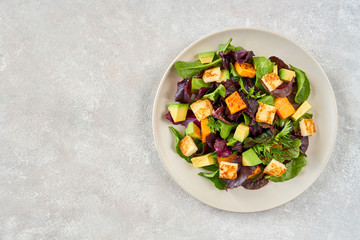 Salad with roast pumpkin , grilled halloumi and avocado