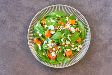 Roast pumpkin, spinach, almond and feta salad. Top view