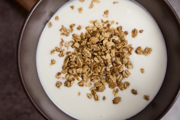 Healthy breakfast with muesli in banana yogurt top view