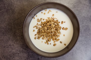 Healthy breakfast with muesli in banana yogurt top view