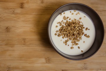 Healthy breakfast with muesli in banana yogurt top view