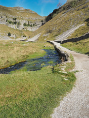 Track leading into the rock cleft of Gordale Scar with Gordale Beck flowing alongside, Malham,...