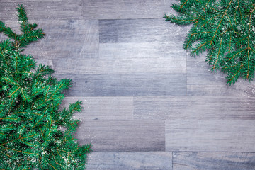 spruce branches on a wooden background of gray.    Happy New Year! procurement for the design and...