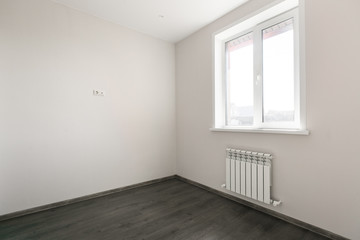 unfurnished house or apartment in bright colors with a dark floor