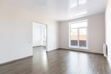 unfurnished house or apartment in bright colors with a dark floor